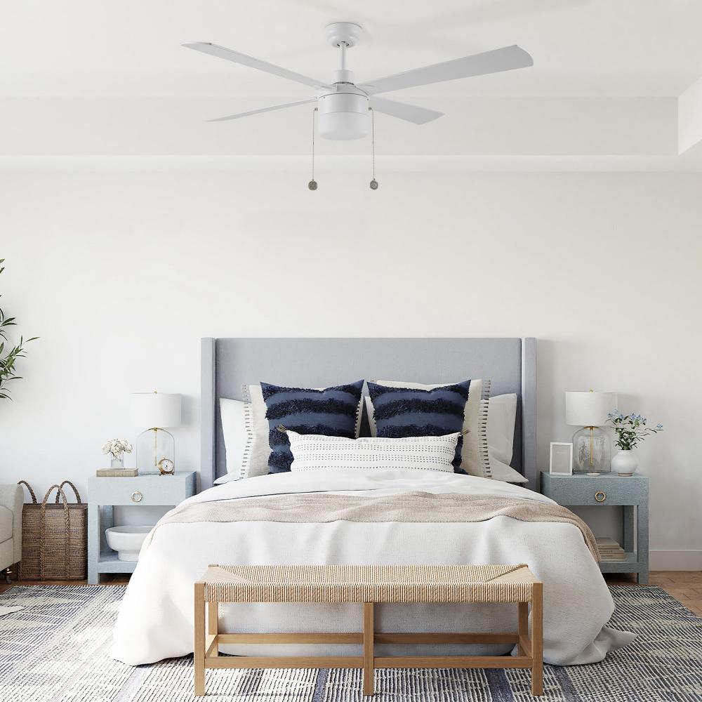 52-inch white ceiling fan with LED light and pull chain control 
 in elegant linen filled bedroom design 