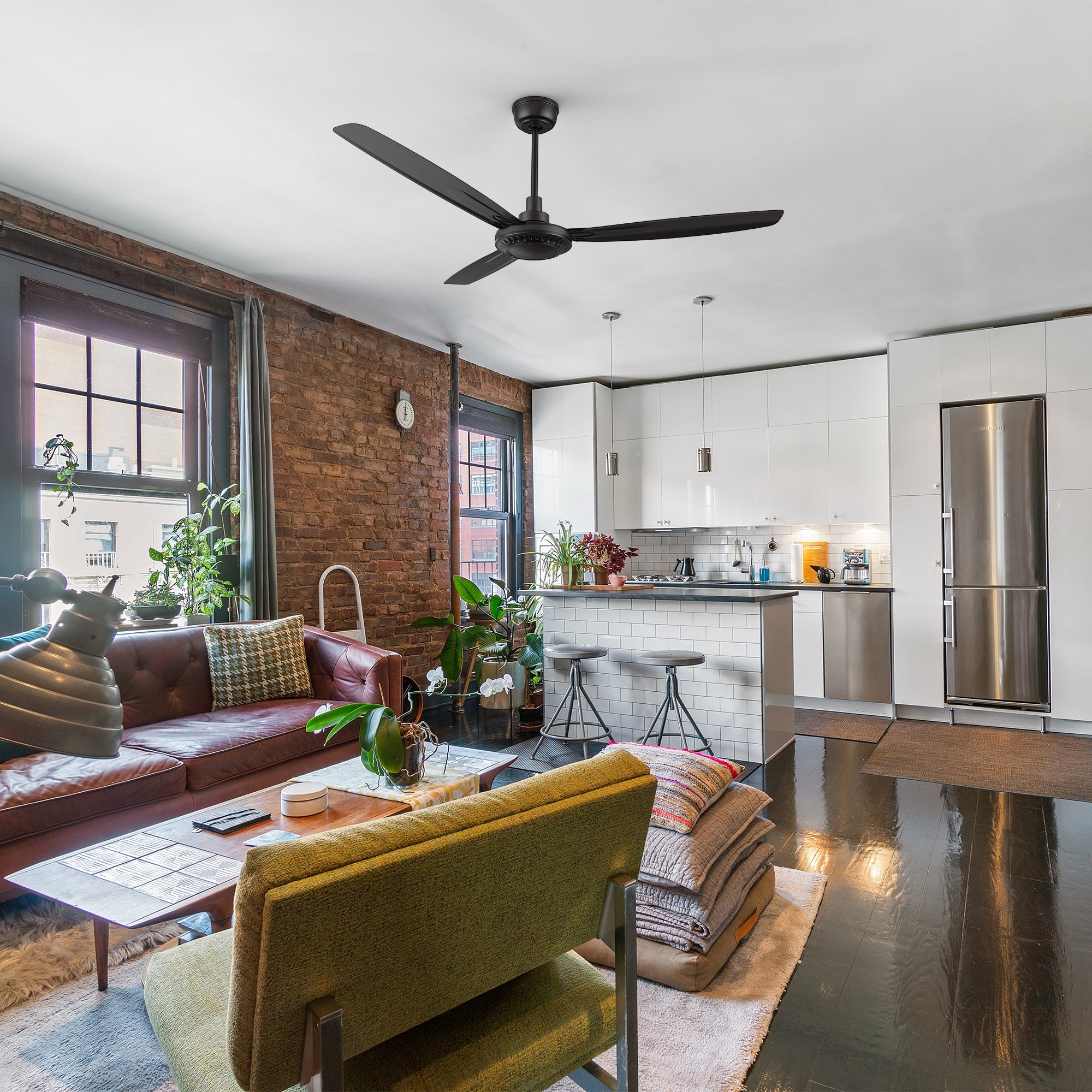 Alya black ceiling fan with 3 blades and a quiet DC motor, fitting well in a contemporary living room.  Designed with an industrial aesthetic and installed with a downrod. 