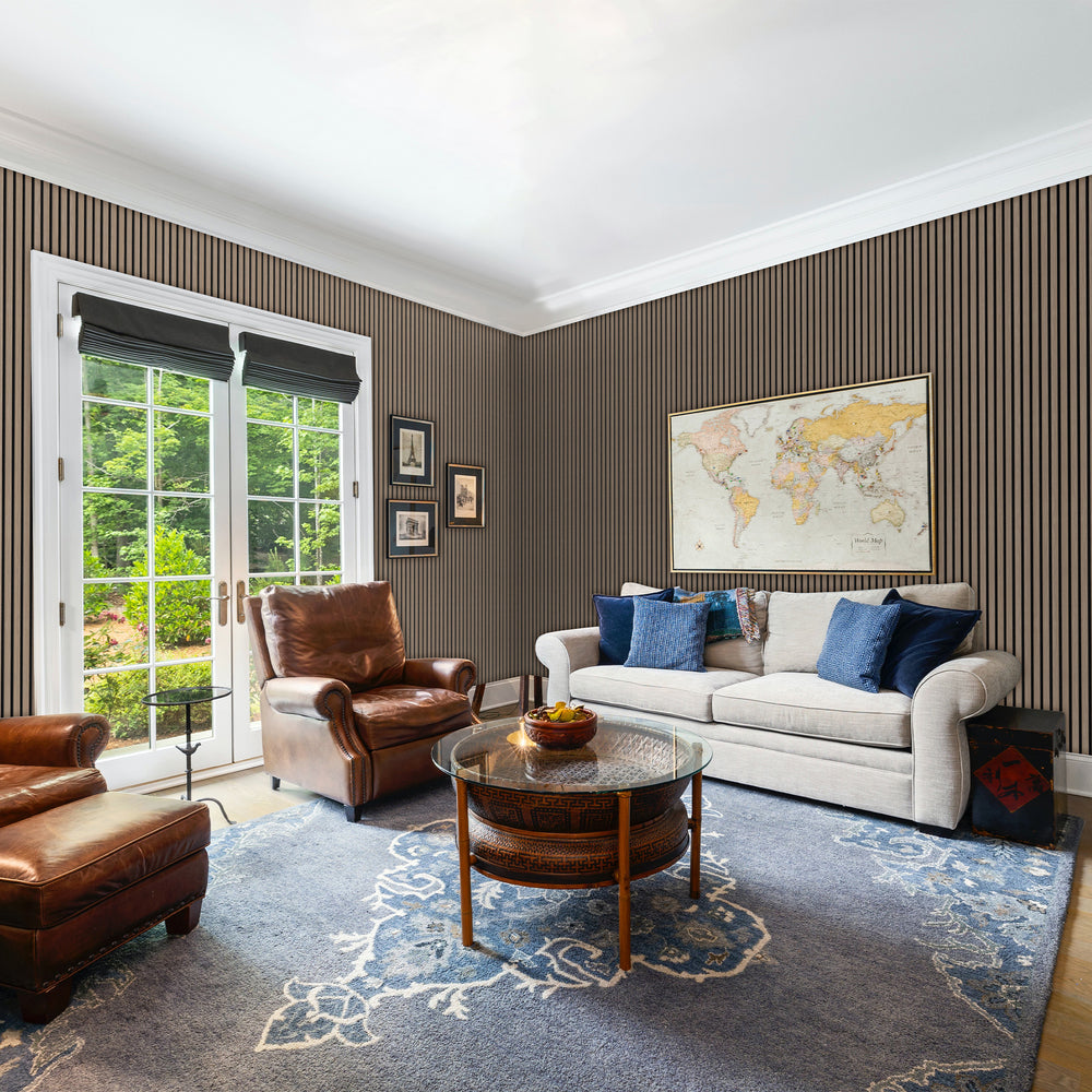 Traditional living room featuring black felt natural walnut acoustic slat wall panels with ample seating and natural lighting. Perfect for soundproofing and timeless interiors.