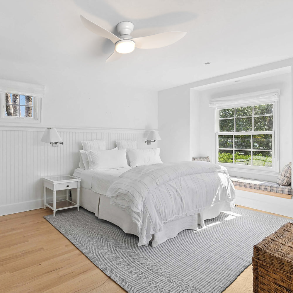 45 inch white flush mount ceiling fan with dimmable LED light and remote in modern bedroom. 