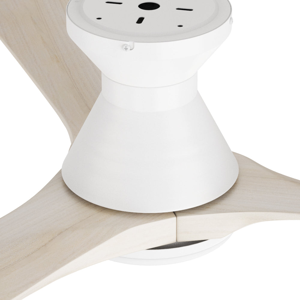 Close-up view of a white flush mount ceiling fan motor housing and canopy with 3 light wood grain blades. 
