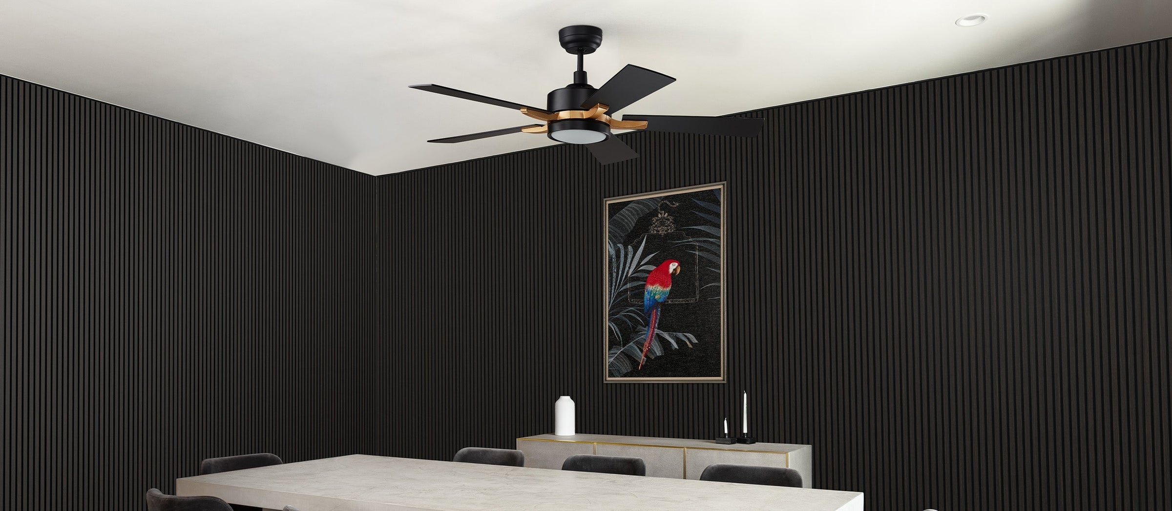 Dining space showcasing 52 inch Apex black ceiling fan with LED light and smart, paired with black acoustic wall panels and minimalist wall art. Perfect for modern, quiet dining areas.
