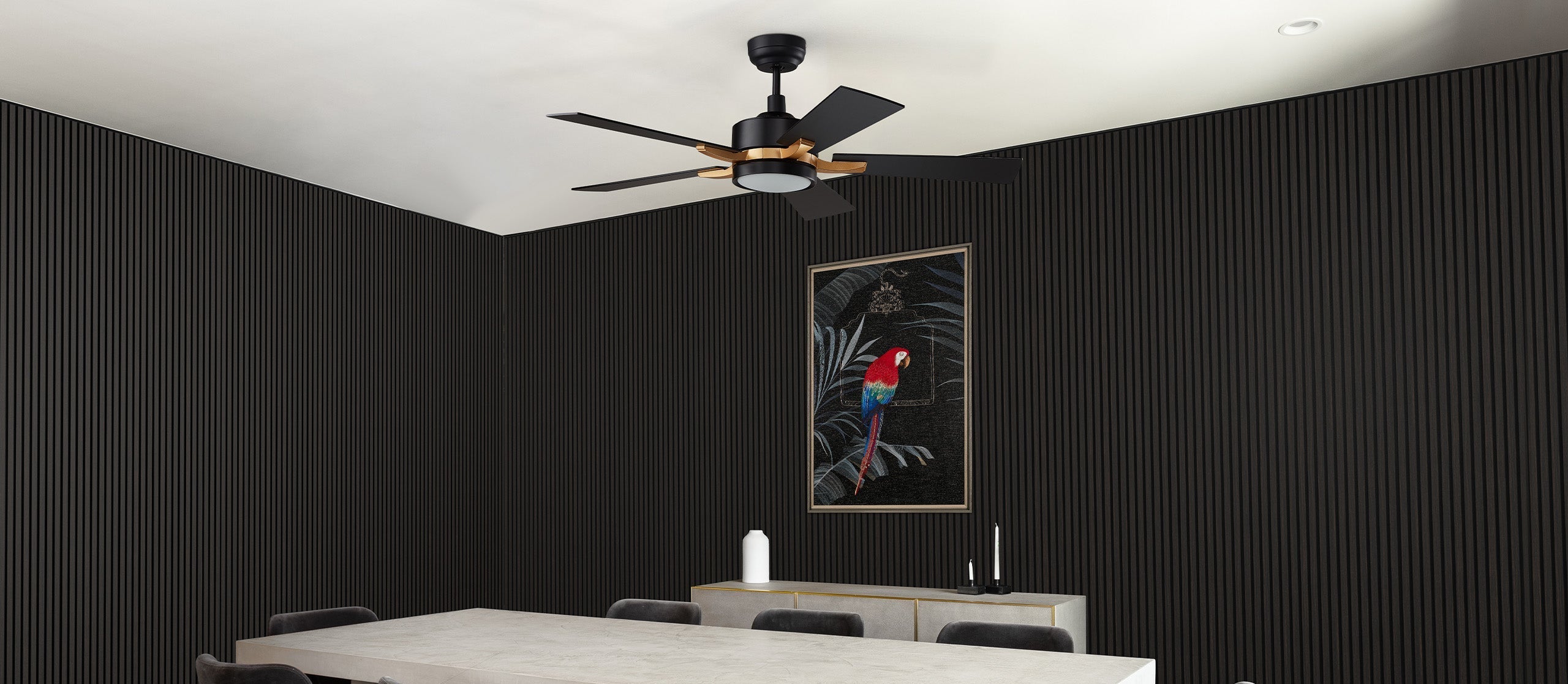 Dining space showcasing 52 inch Apex black ceiling fan with LED light and smart, paired with black acoustic wall panels and minimalist wall art. Perfect for modern, quiet dining areas.