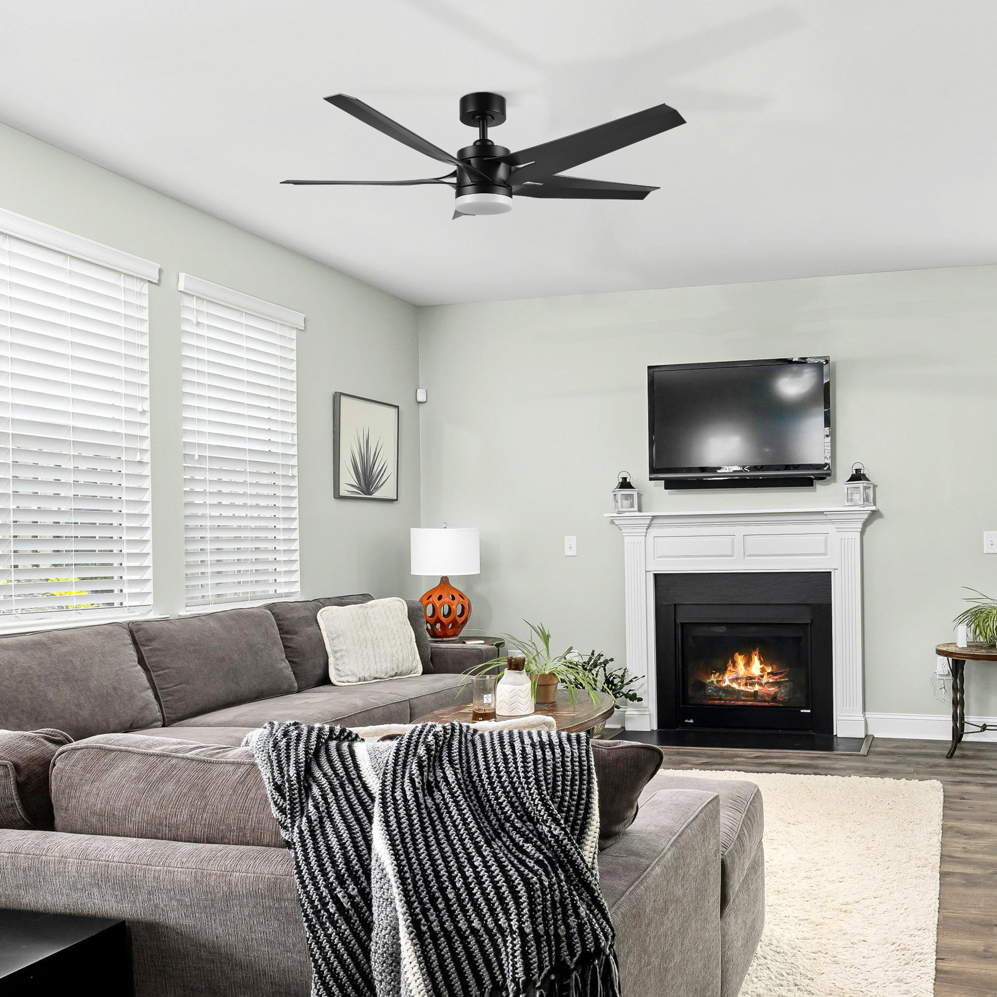 Araceli 52-inch DC ceiling fan with LED light and remote installed in a cozy living room setting, blending modern style with comfort. 