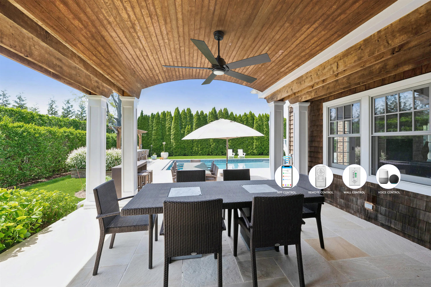 Covered outdoor patio featuring the Smafan Aspen 56 inch smart ceiling fan with light, mounted above a dining table overlooking a pool—ideal for Father's Day backyard gatherings.