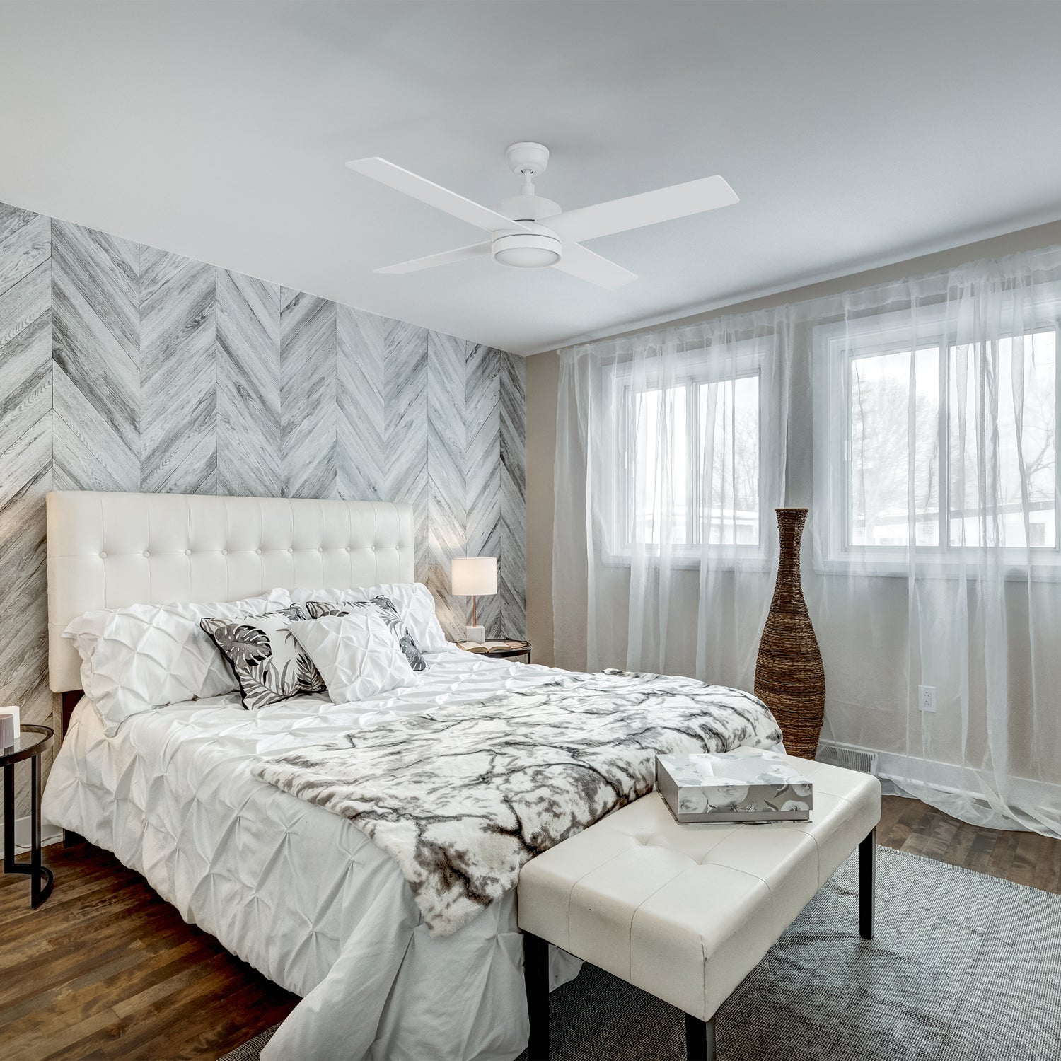 Smafan Rossendale 52-inch white ceiling fan with LED light in a modern bedroom featuring a white bed, neutral tones, and soft natural light. 