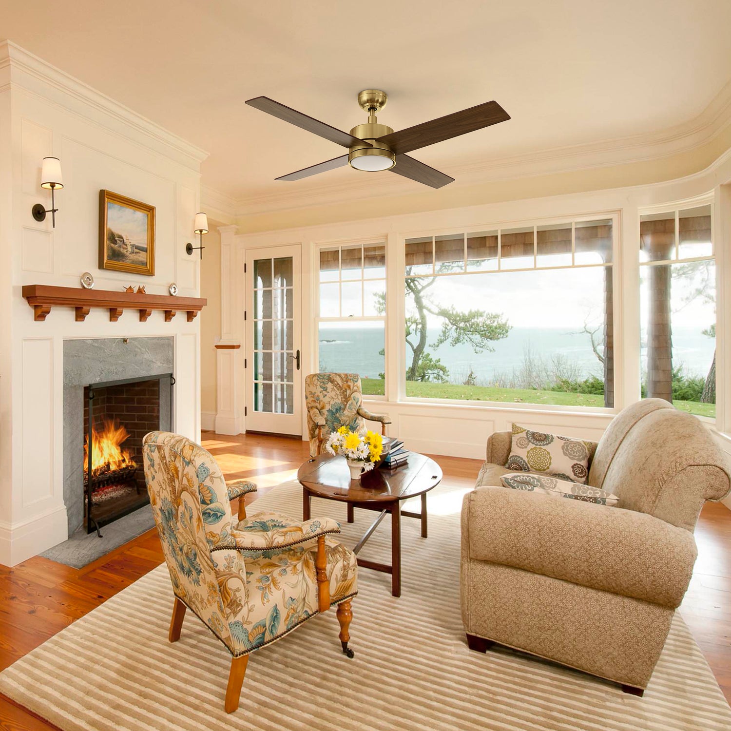 Traditional living room showcasing the Carro Smafan Rossendale 52-inch ceiling fan with LED light in a brushed gold finish. 