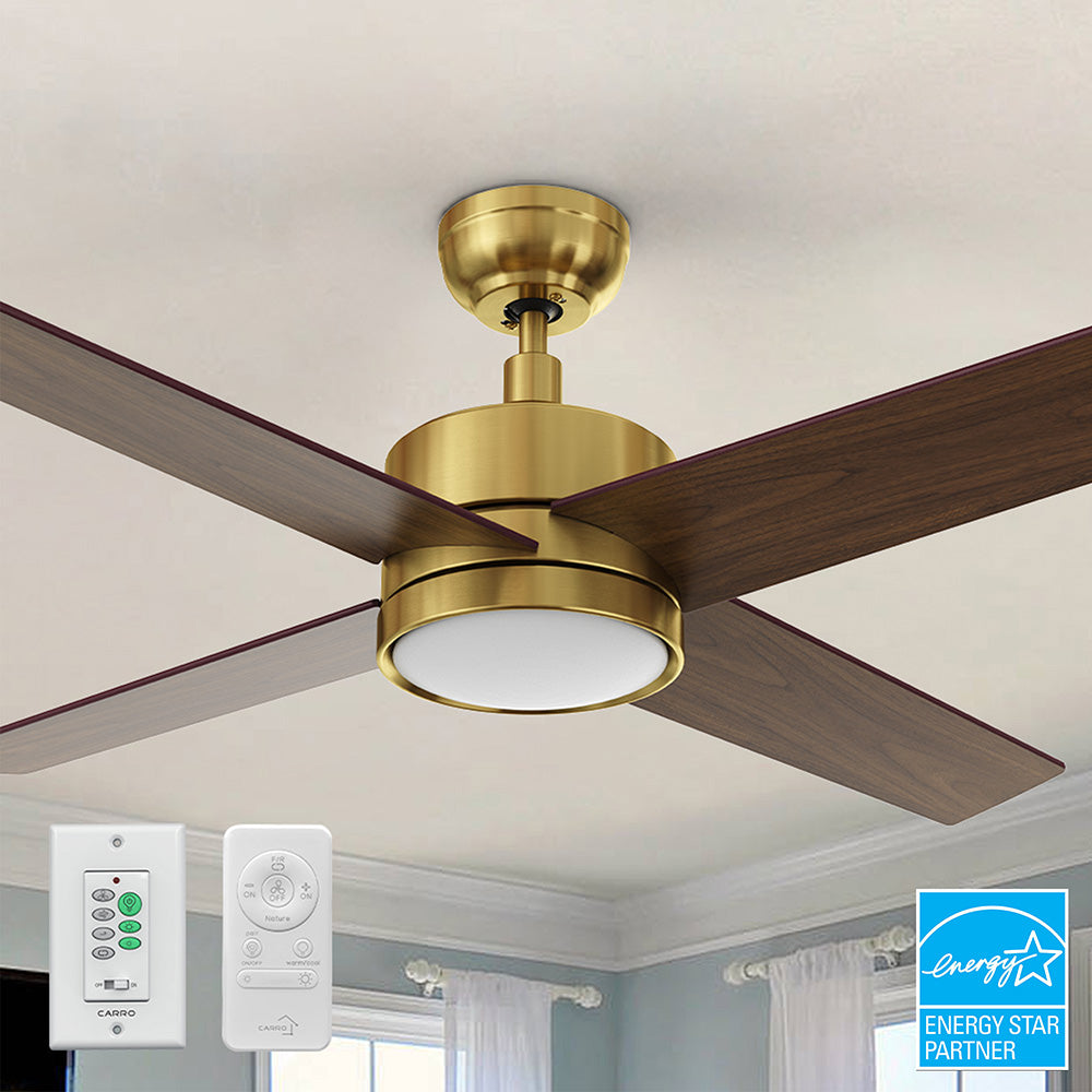 Close-up of the Carro Smafan Rossendale 52-inch ceiling fan in brushed gold, shown with a remote and wall switch for control. 