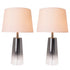 A pair of Carro Smafan Rosemary Table Lamps, 25 inches tall, with Chrome Grey Ombre finish and white shades, placed on nightstands in a bedroom. The lamps provide warm lighting, enhancing the room&