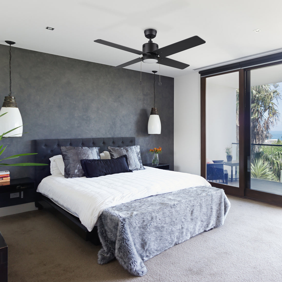Carro Smafan Rowan 52 inch modern ceiling fan with LED light, black finish, and 4 Polywood blades in a stylish bedroom.
