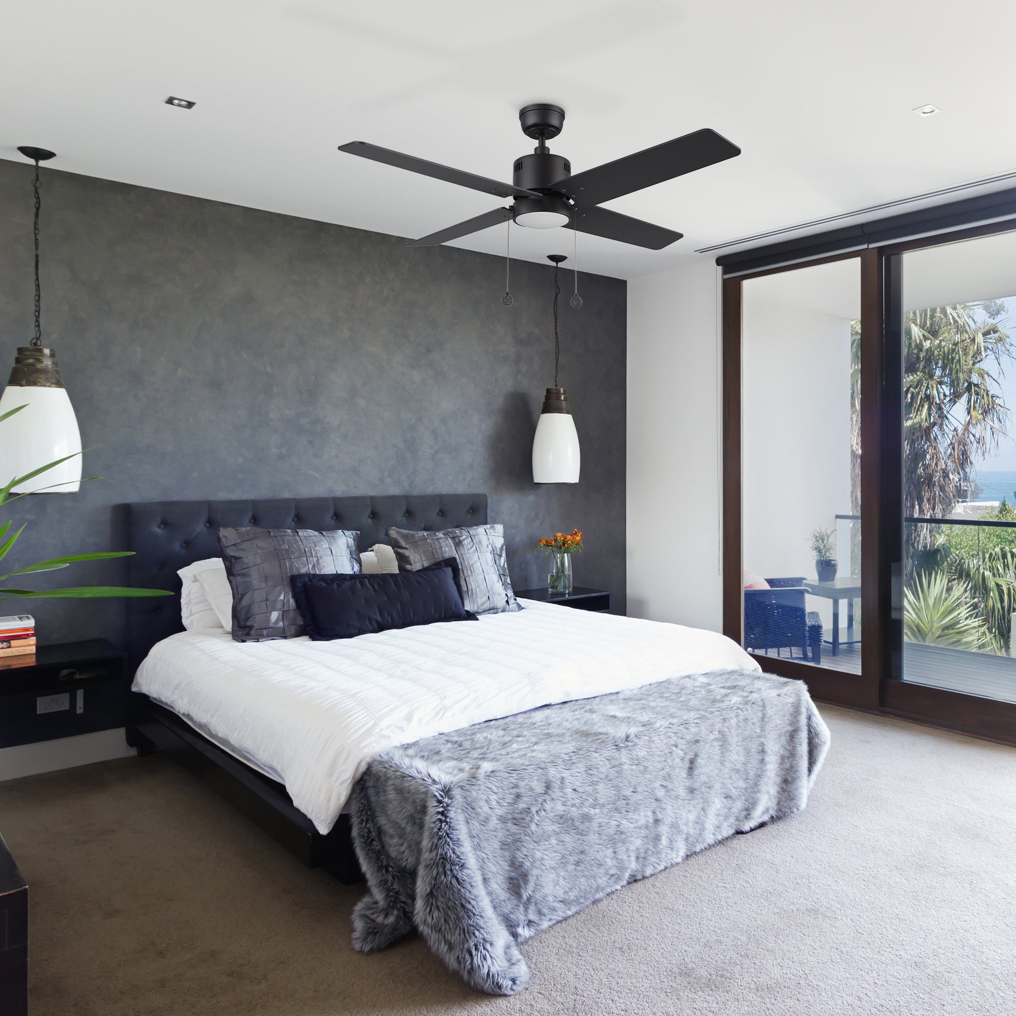 Carro Smafan Rowan 52 inch modern ceiling fan with LED light, black finish, and 4 Polywood blades in a stylish bedroom.#color_black