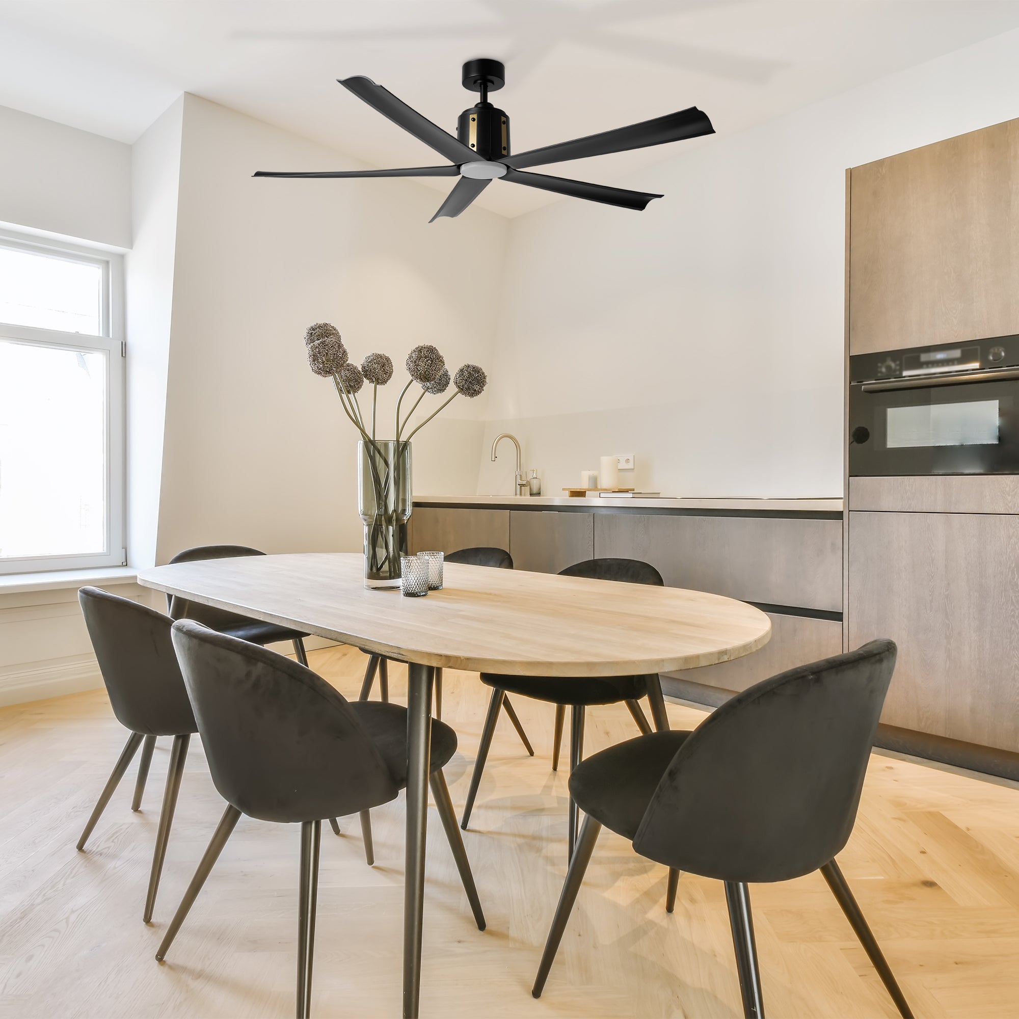 The Zahar 60-inch black ceiling fan with LED light is installed in a modern dining room, enhancing the space with its sleek design. 