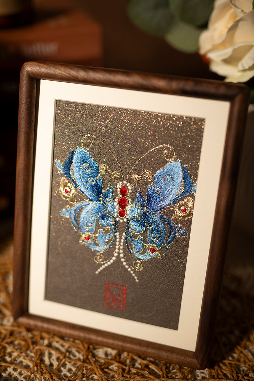 This embroidery design shows us with blue and shining butterfly, is a beautiful desk decoration which made of various color silk threads.