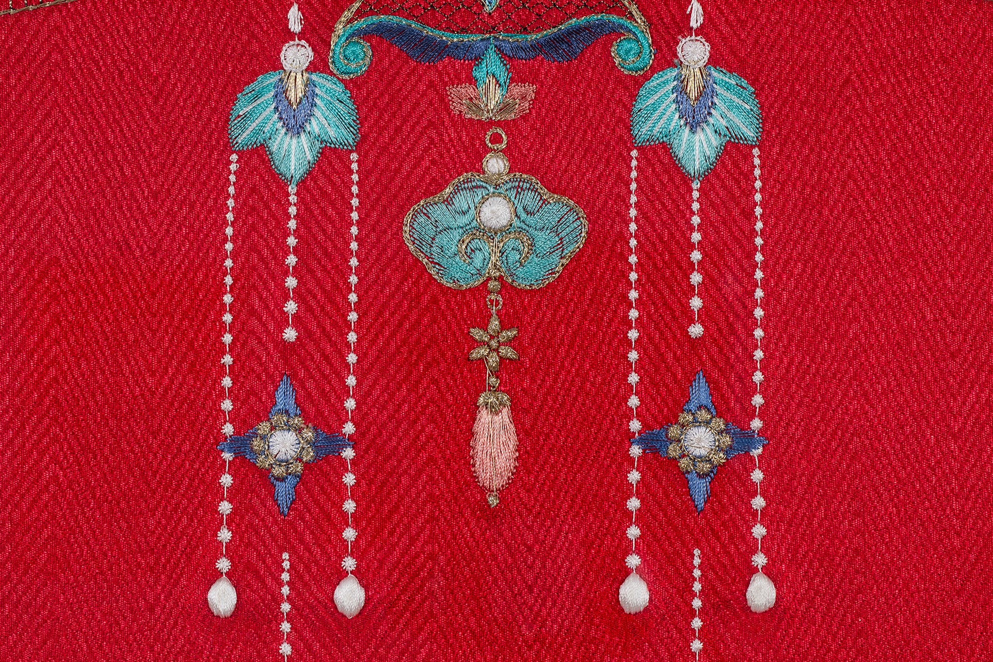 Bottom detail of an Oriental phoenix crown's Ruyi Pendant embroidery artwork.