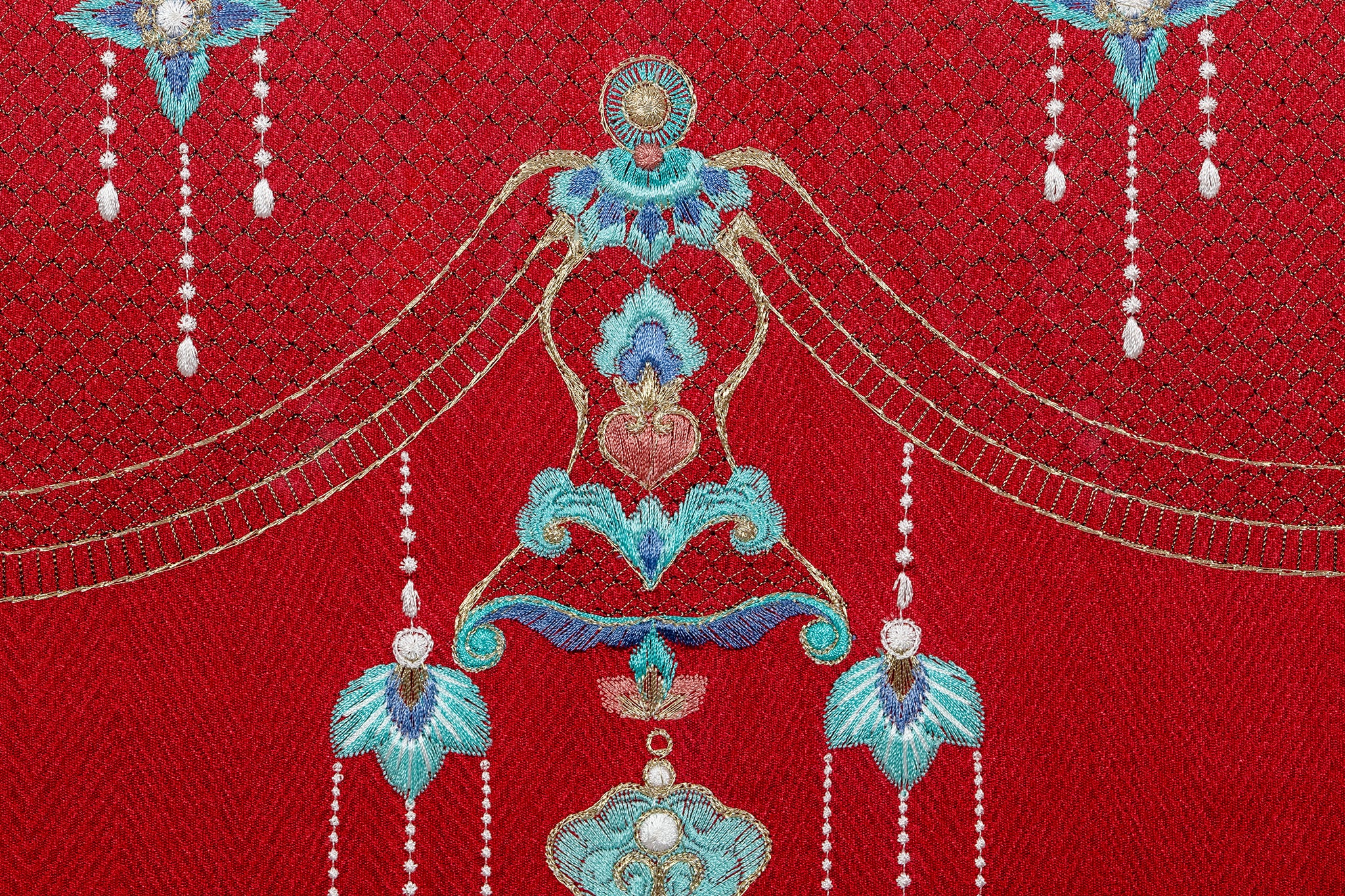 Embroidery artwork's bottom detail of an Oriental phoenix coronet with night-shining jewel and gourd .