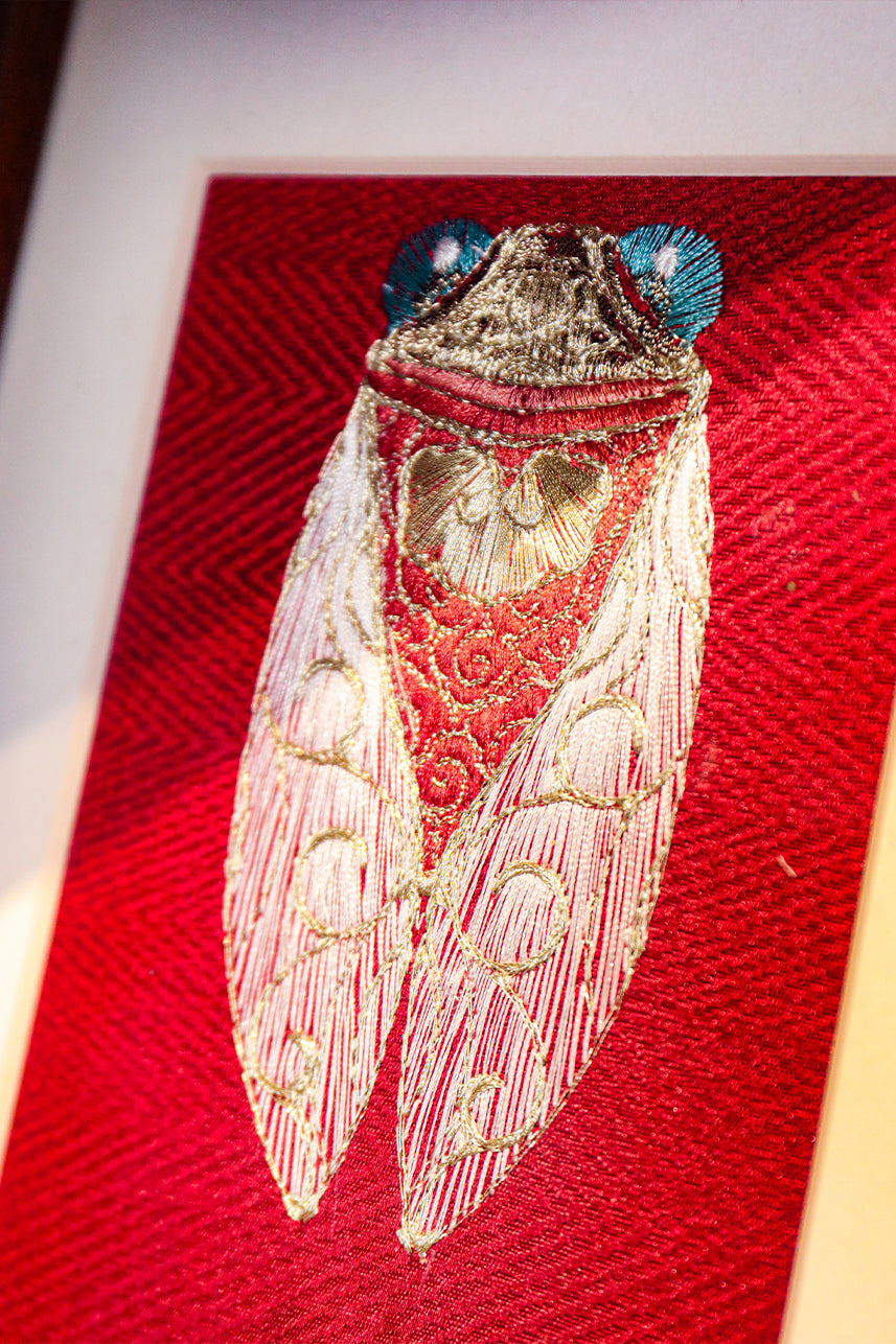 A piece of embroidery art about cicadas