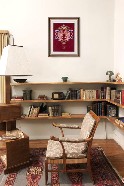 In an elegant study, an embroidered artwork with double koi fish hangs on wall.