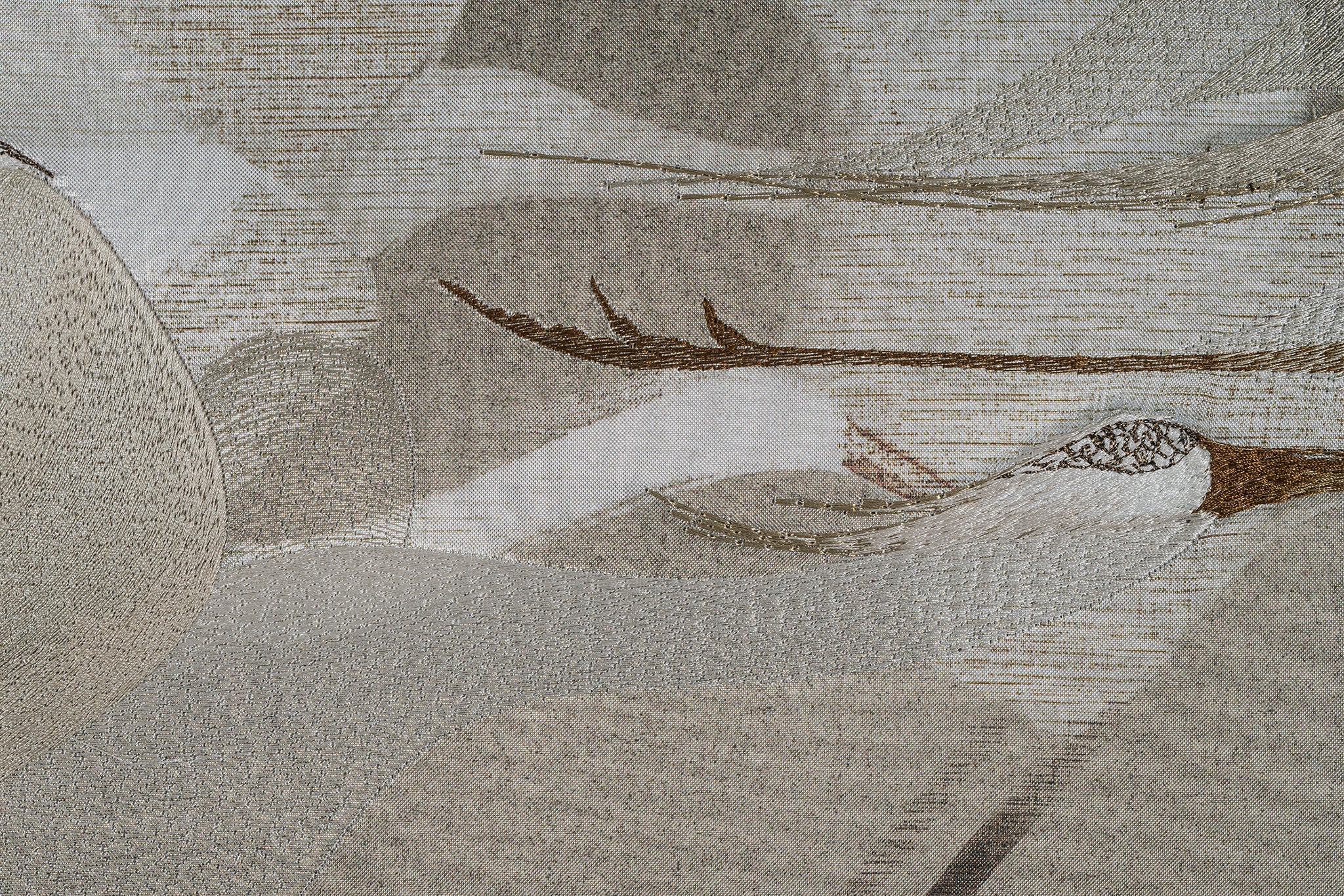 Detailed close-up of framed embroidery artwork highlighting the intricate stitching and texture of the flock of egrets design.