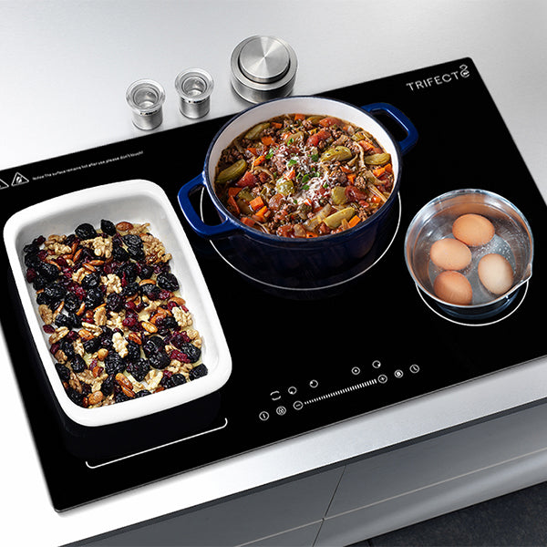 There are some food staying on the 30" induction cooktop of black glass-ceramic surface, such as boiling eggs, simmering soup and nut roast.