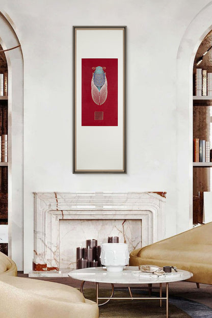 A cozy living room with a fireplace. A framed embroidery artwork featuring a cicada design hangs above the fireplace, adding a stylish and artistic touch to the room.