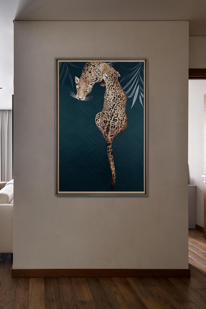 Framed Embroidery Fine Wall Art of Leopard Design hanging on a neutral-colored wall in a hallway or entrance area with wooden flooring.