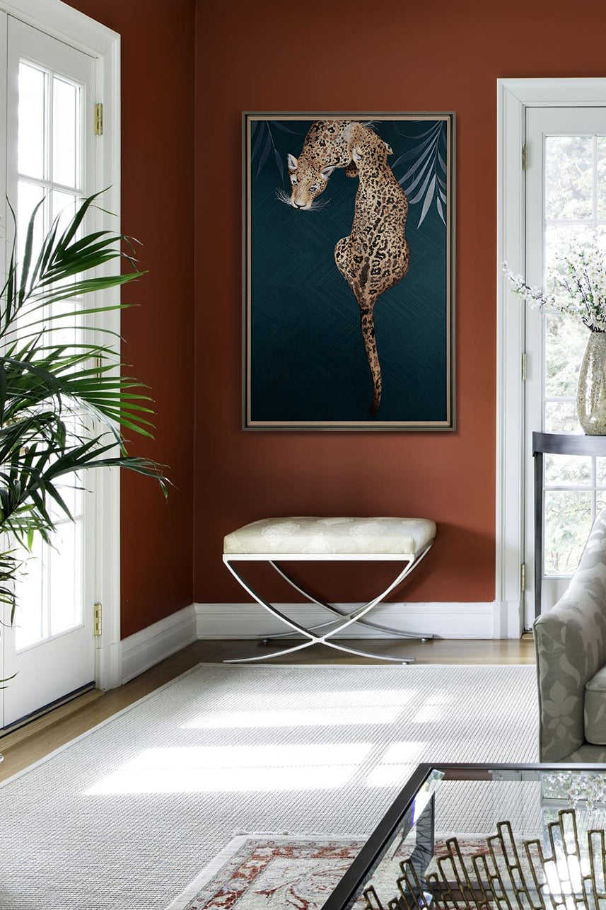 Framed Embroidery Fine Wall Art of Leopard Design showcased in a contemporary living room with red walls and large windows.