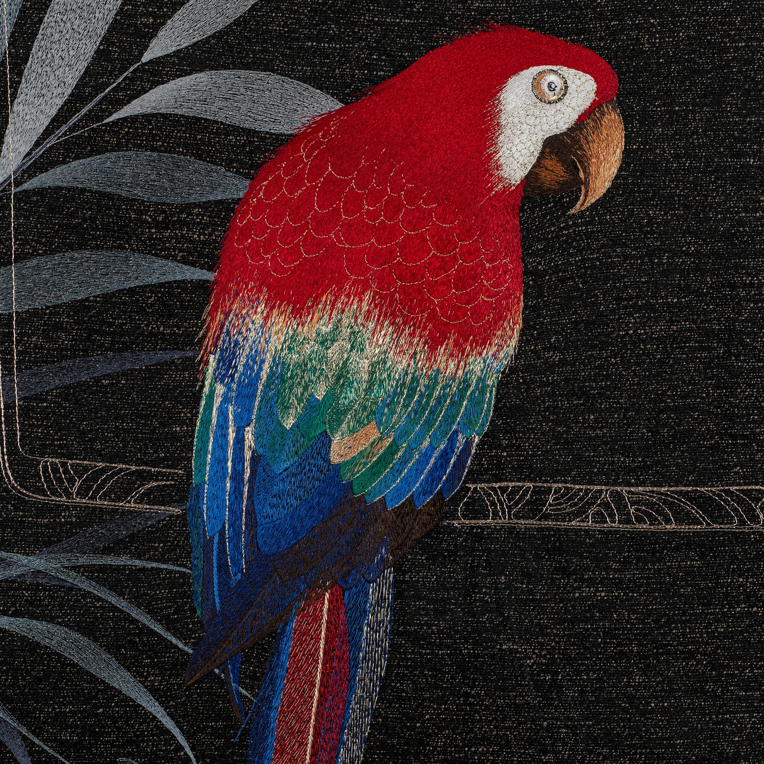 The parrot embroidery details of various color silk embroidery threads.