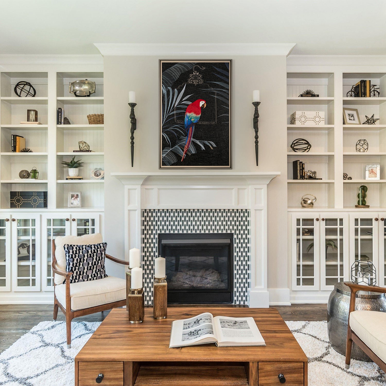 An framed embroidered work of art with a parrot is hung on the wall above the fireplace in the living room.  The tropical atmosphere is integrated with the modern living room, which makes the whole living room very luxurious and energetic.