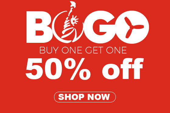 A promotional banner with a red background, featuring white text at the top reading “BOGO” with a Statue of Liberty icon and a fan blade design, middle text reading “BUY ONE GET ONE 50% off,” and a white circular button at the bottom with “SHOP NOW” written on it.