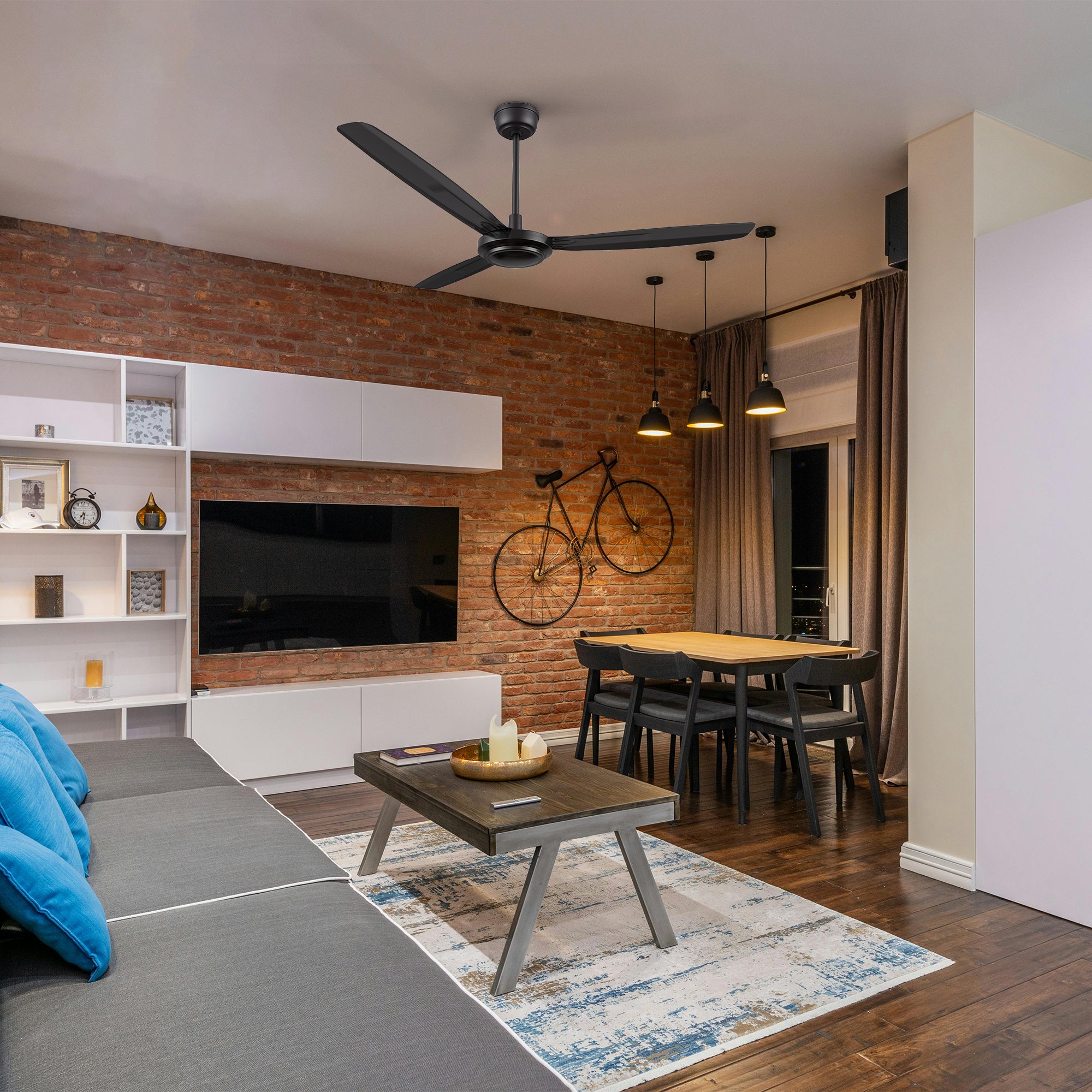 Modern living room with large windows, featuring the Kade 56-inch black ceiling Kade 56-inch modern black ceiling fan with remote control mounted in an industrial-style living and dining space featuring exposed brick walls, dark wood flooring, and minimalist furniture. 