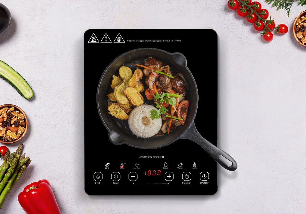 11" black portable induction cooktop on the kitchen counter is frying the mushroom, potato and rice.