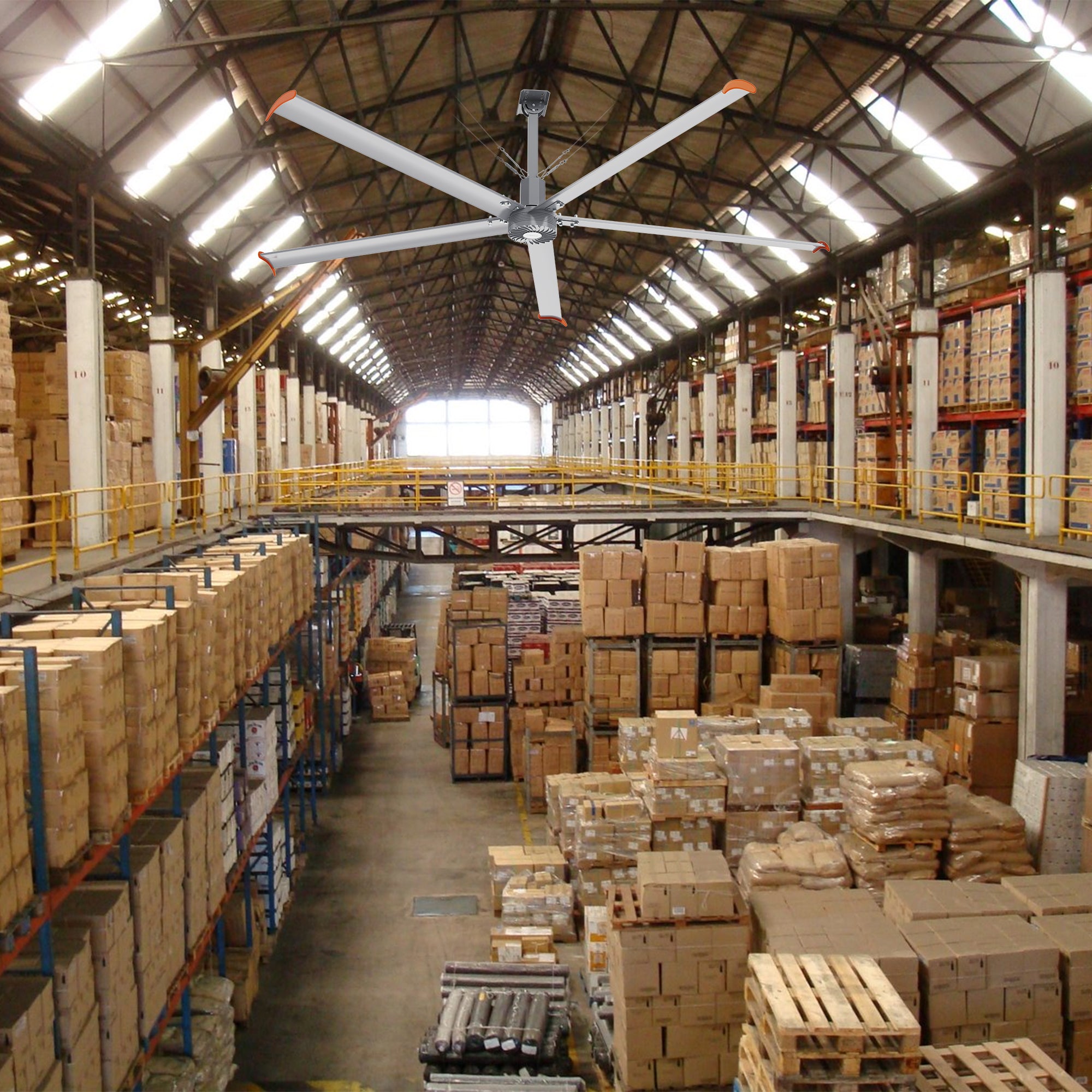 Makani 12ft industrial HVLS overhead fan installed in a warehouse, featuring 240V power to ensure efficient cooling and ventilation across extensive storage areas. 