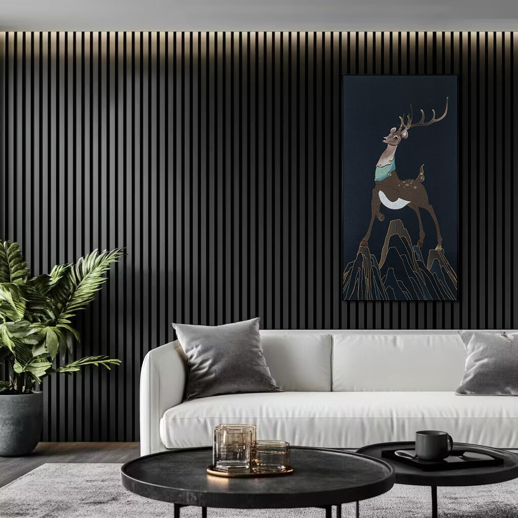 Modern living room featuring black matte acoustic slat wall panels paired with a white sofa, creating a contrasting and elegant design.