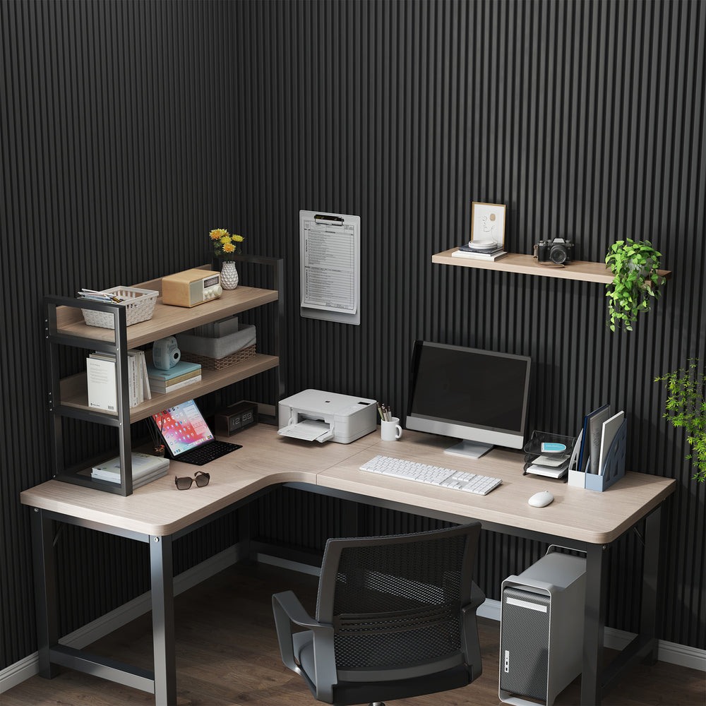 Modern home office setup featuring matte black acoustic slat wall panels, providing a sleek and soundproof background. The workspace includes a light wood L-shaped desk, a computer monitor, shelves with decor and greenery, and organized office accessories, creating a productive and stylish study area.