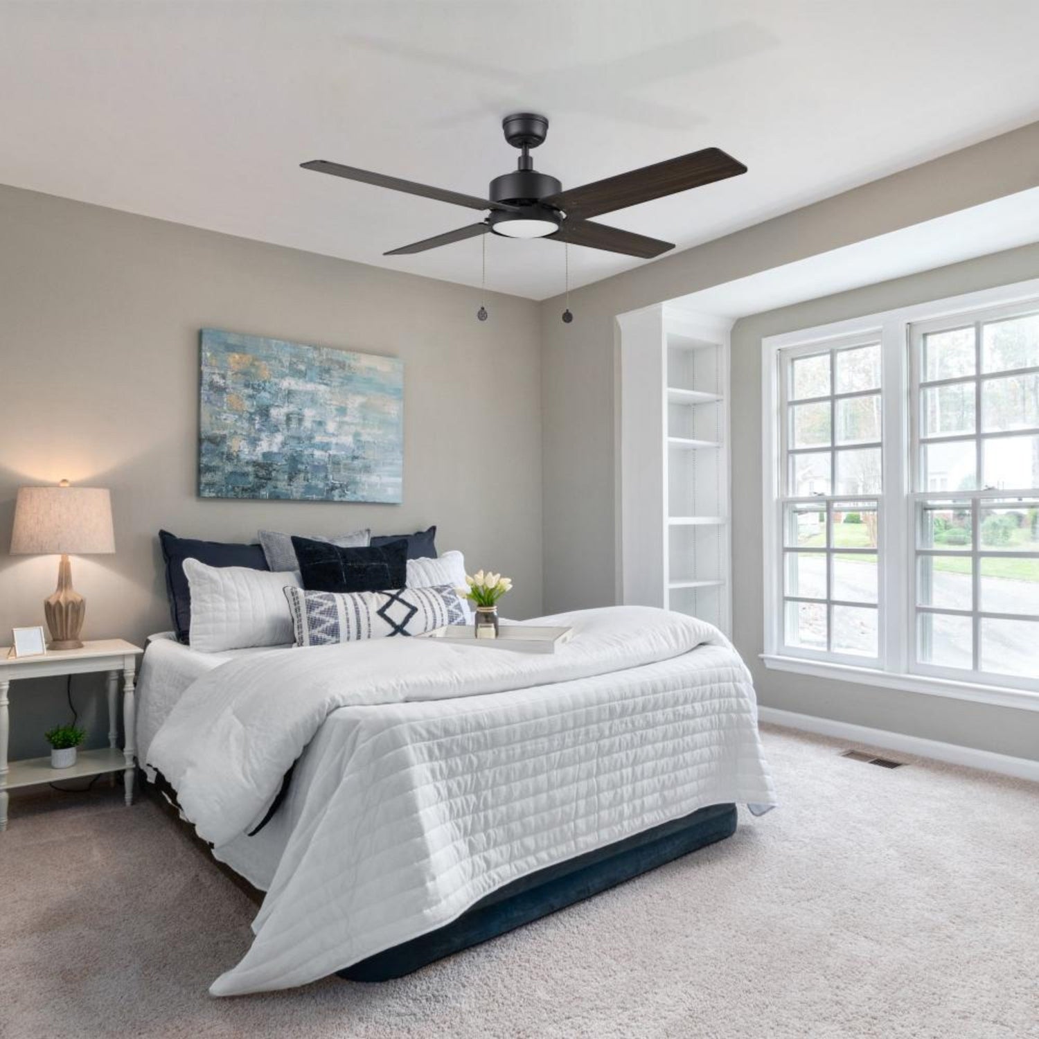 Nazzano 52-inch ceiling fan with LED light in dark wood finish installed in a modern bedroom. 