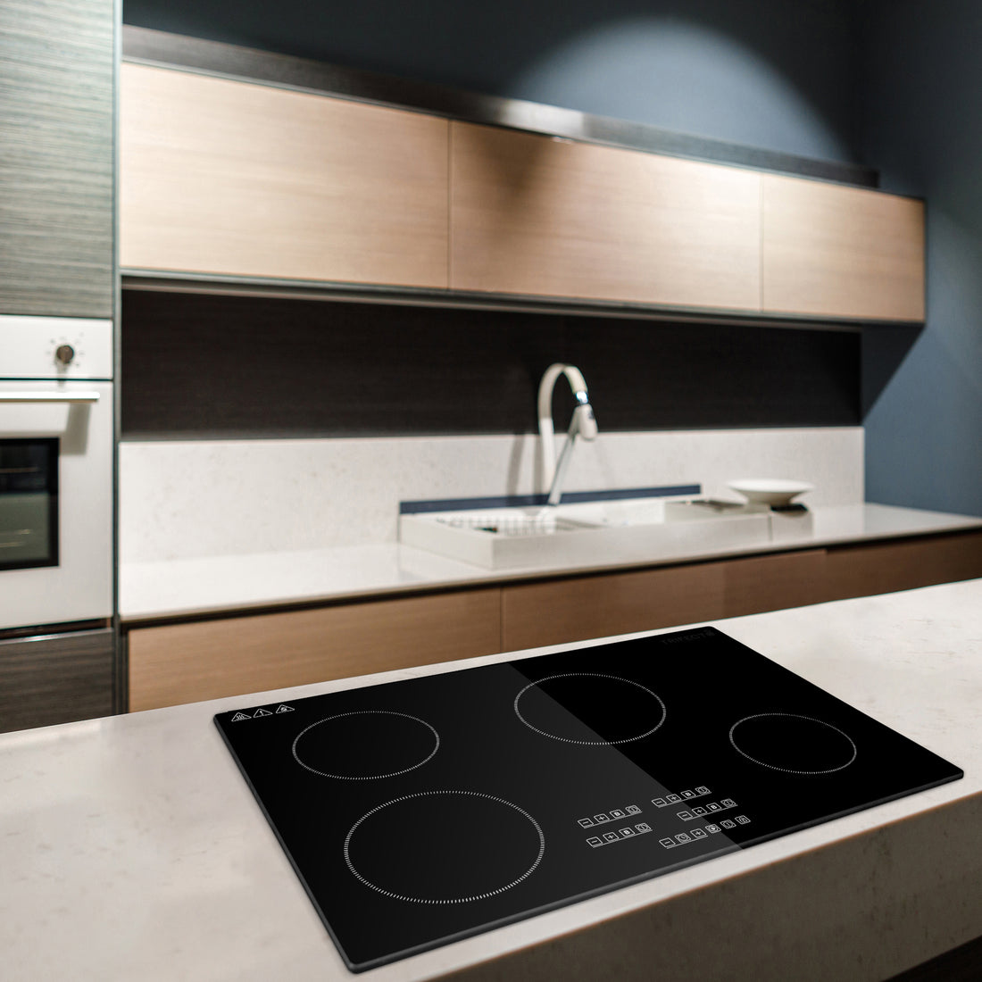 30-inch induction cooktop with four burners in modern kitchen.