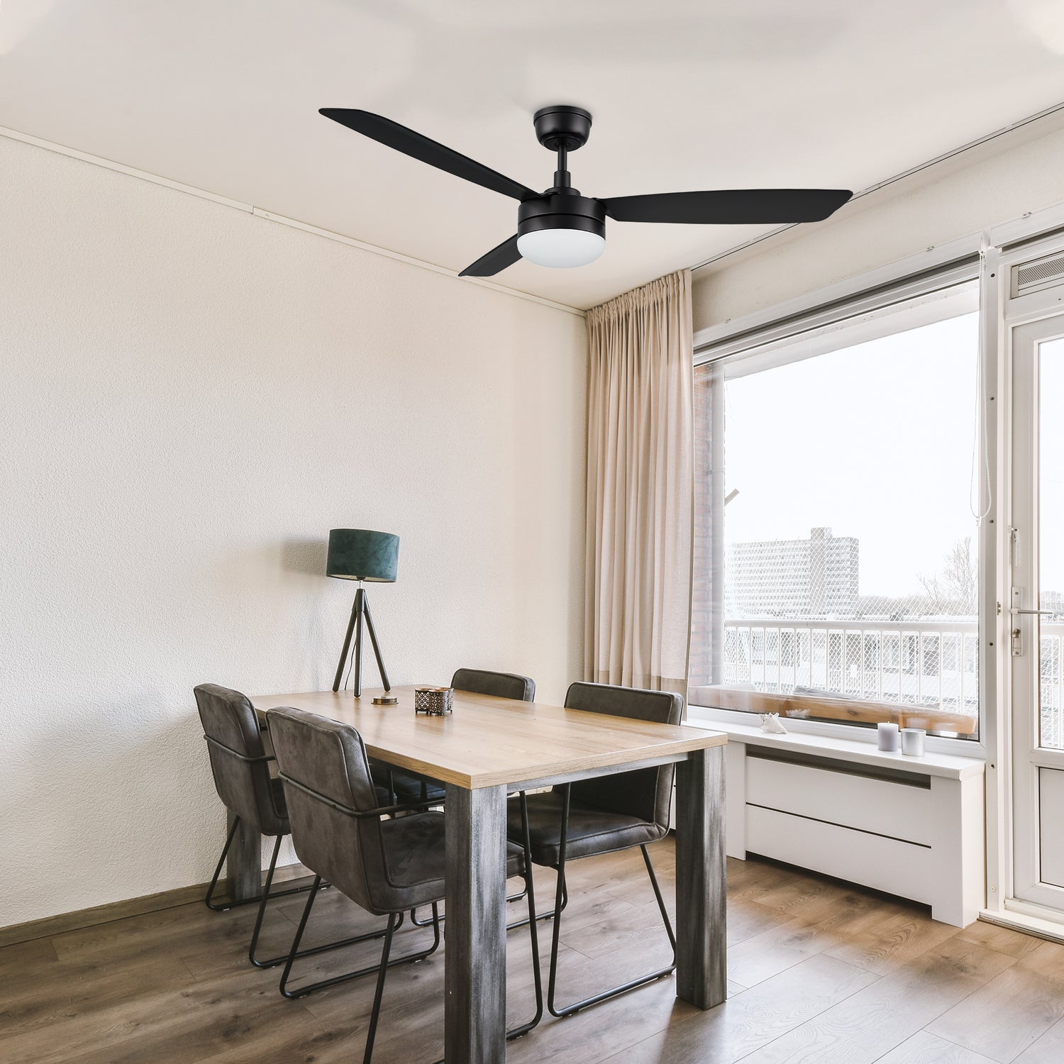 52 inch 3-blade ceiling fan with LED light, installed in a modern dining room with a sleek black finish. 