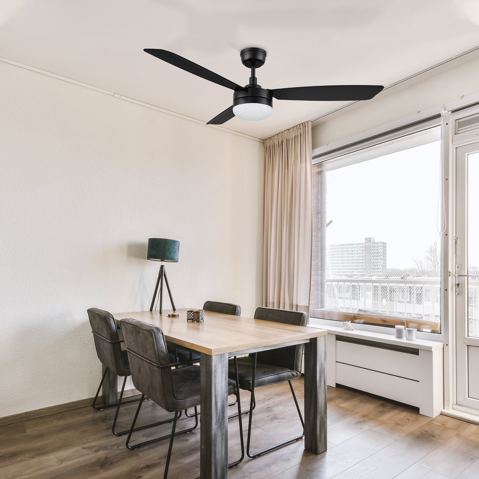 52 inch 3-blade ceiling fan with LED light, installed in a modern dining room with a sleek black finish. 