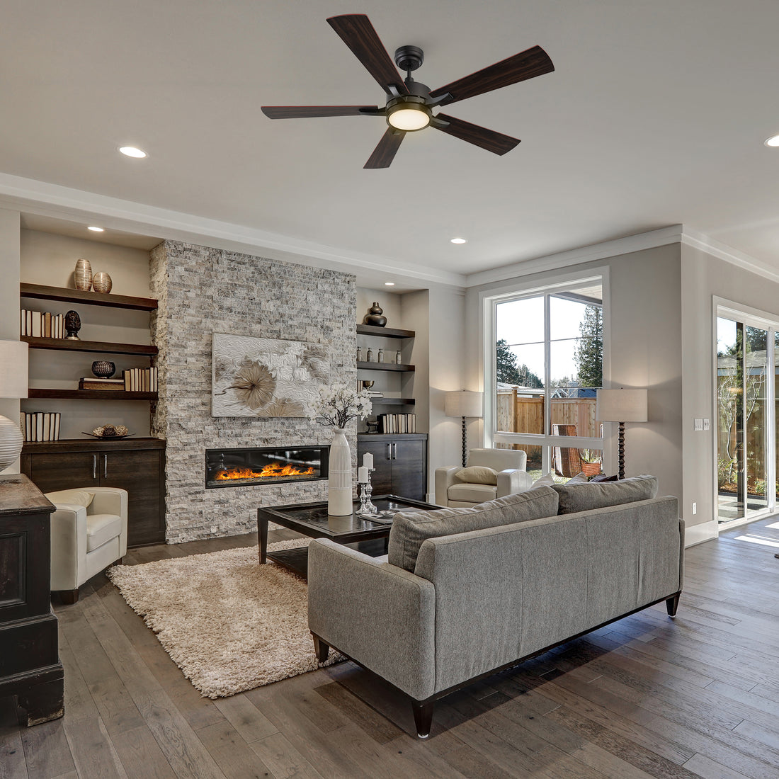 56-inch downrod mounting ceiling fan with dimmable LED light and remote, matching with grey plush sofa and light beige coral velvet carpet, make the living room more modern.
