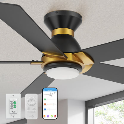 Carro Aspen 52-inch black and gold flush mount smart ceiling fan with light, featuring a silent DC motor, smart app, remote, and wall control. Shown in a modern living room closed view with warm ambient lighting. 