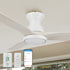 An image of a Smafan Carro Colmar2 52-inch Flush Mount Smart Outdoor Ceiling Fan with light, featuring light wood blades, mounted on a beige ceiling for efficient airflow and cooling. The ceiling fan is shown with a Carro white wall switch, a handheld remote, and a smartphone displaying a control app, highlighting smart operation for customizable lighting and cooling in outdoor settings. 