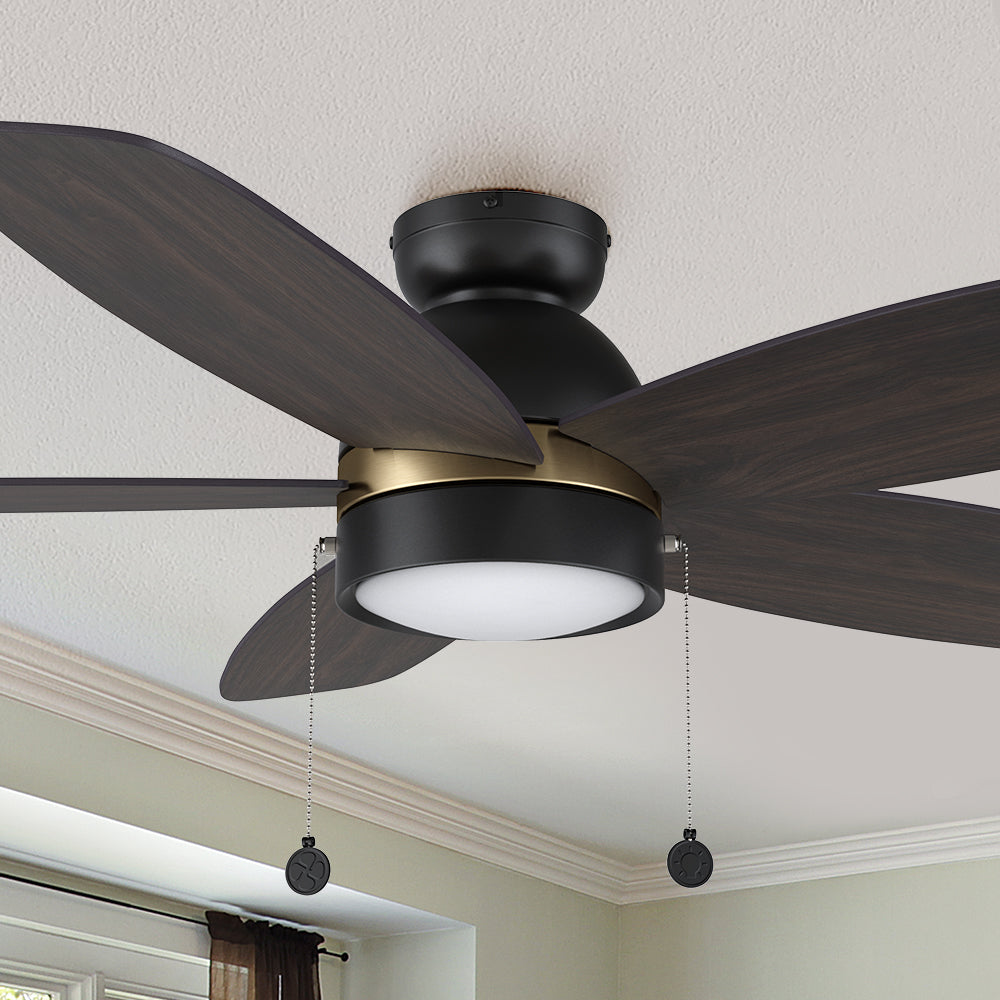 A pristine dark wood exterior, elegant plywood blades, and a charming LED lighting come together to create the subtle yet refined Treyton 52 inch pull chain ceiling fan. #color_Dark-Wood