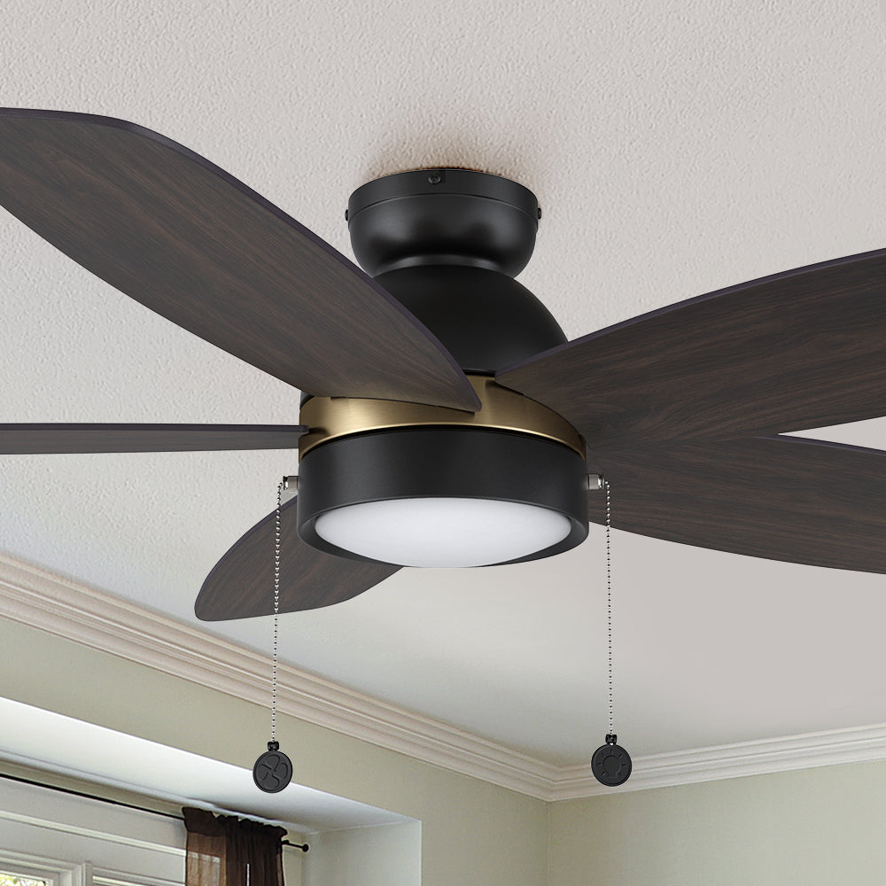 A pristine dark wood exterior, elegant plywood blades, and a charming LED lighting come together to create the subtle yet refined Treyton 52 inch pull chain ceiling fan. #color_dark-wood