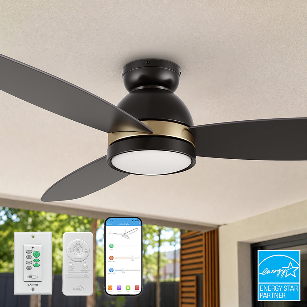 Black and gold flush mount smart ceiling fan with LED light installed on a patio ceiling, showing app, remote, and wall control options with an Energy Star logo. 