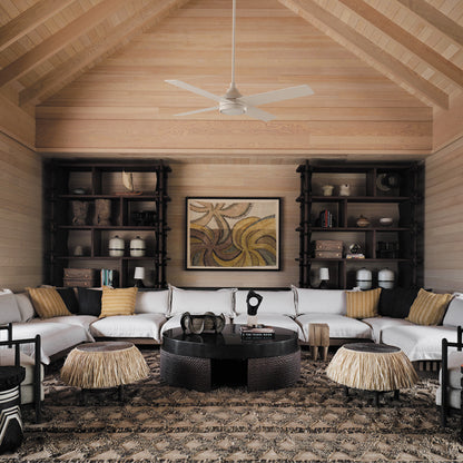 Smafan Bryant 52 inch white ceiling fan with light mounted on a high vaulted wood ceiling in a tribal bohemian resort living room with large white sectional sofa and woven decor accents. 
