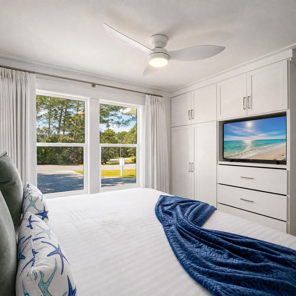 Smafan Cerise 45 inch white low profile ceiling fan with light and smart control installed in a modern bedroom. 