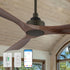 Carro smart ceiling fan with black finish and dark walnut wood blades, featuring included remote controls and a visual representation of its compatible smartphone app. 