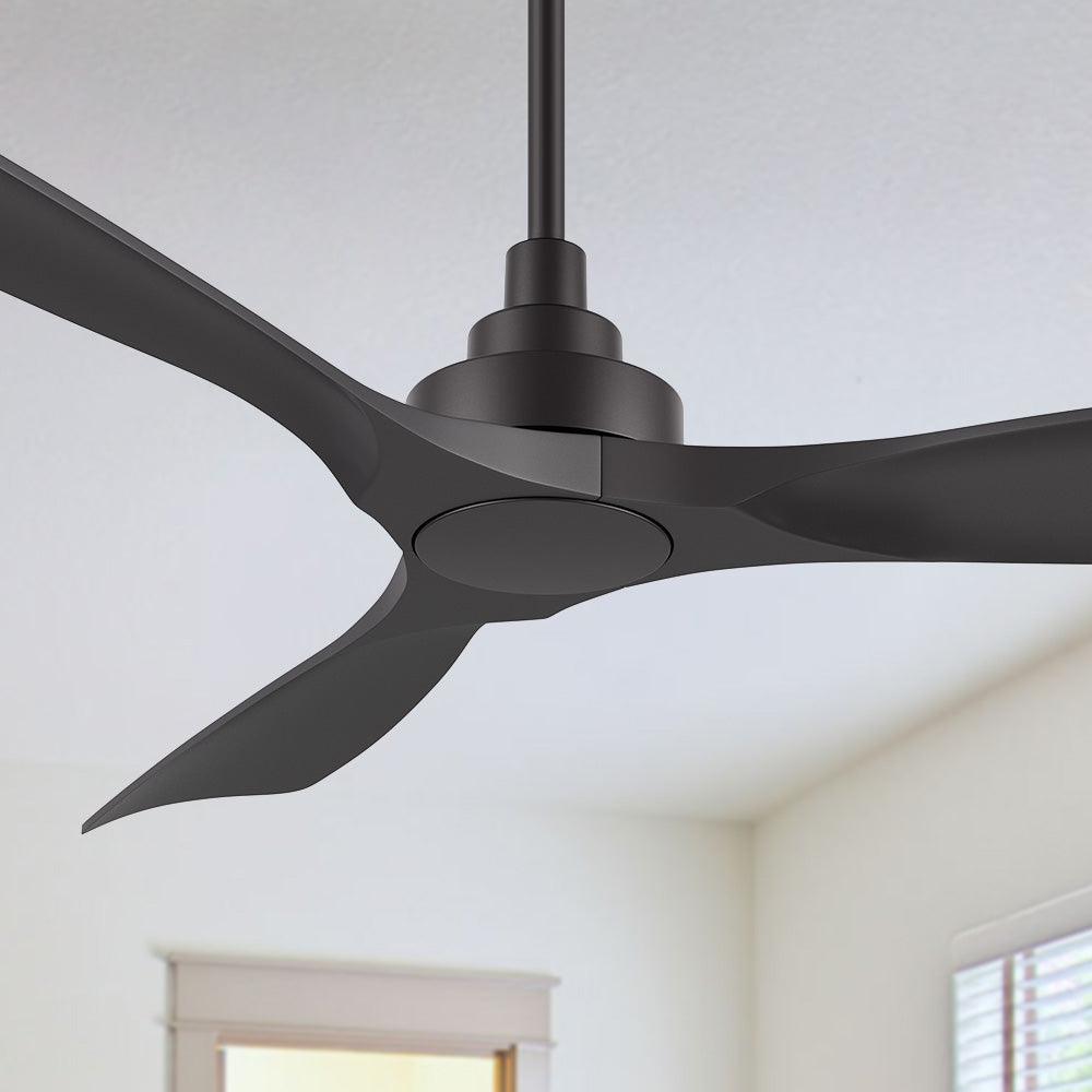 A 52-inch Smafan Kilk smart ceiling fan in black, without light, mounted on a white ceiling in a room with light beige walls, a window with blinds, and a simple indoor setting visible in the background. 