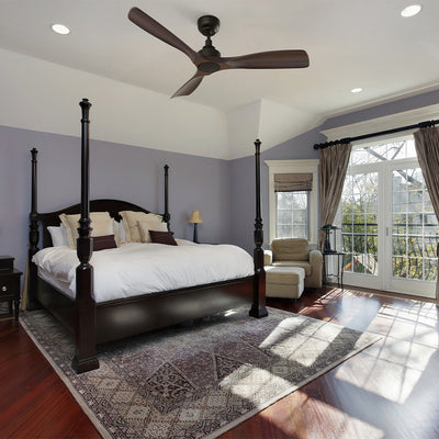 Elegant bedroom with dark four-poster bed and Smafan Kilk 52" modern dark wood ceiling fan on vaulted white ceiling. Answers can I put ceiling fan over bed – yes, with proper mounting. #color_wood
