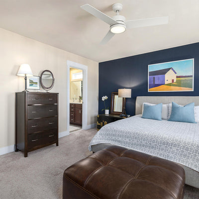 Modern bedroom with Smafan Louy 52" 3-blade ceiling fan with light, navy accent wall, upholstered bed, and clean decor. A bedroom ceiling fan with light in crisp white finish. #color_white-light-wood